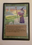 Black bordered and featuring a pop out of the wizard who is summoning gush from afar.  Currently in my vintage deck
